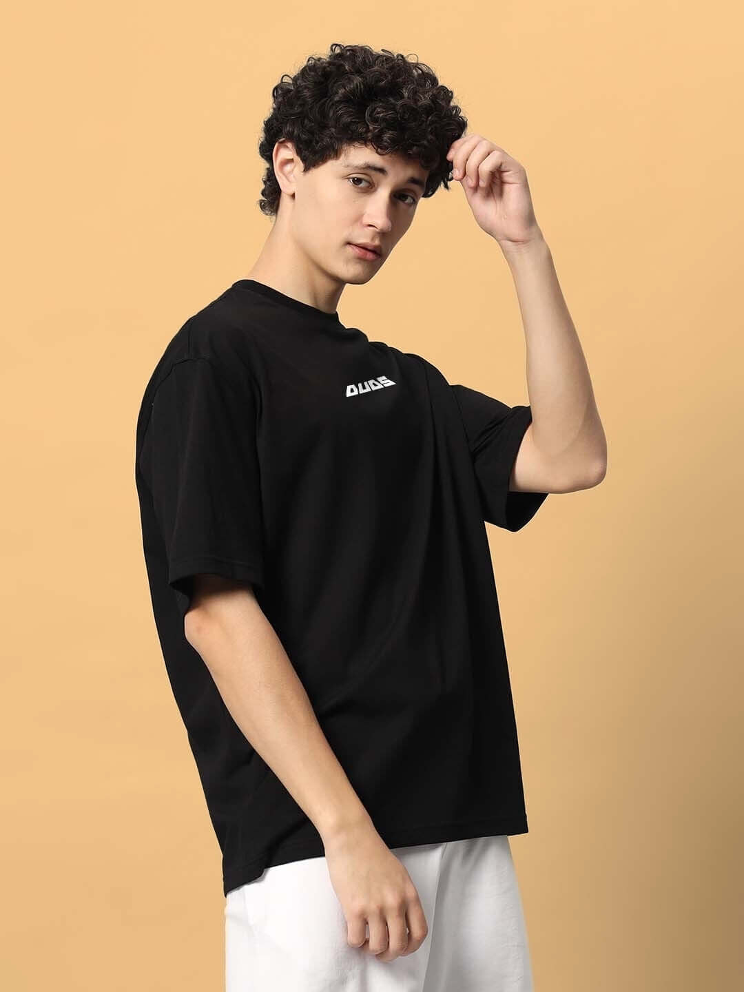 Model wearing FREE BIRD OVER-SIZED T-SHIRT BLACK with short sleeves, suitable for custom fit option, available with preorder.