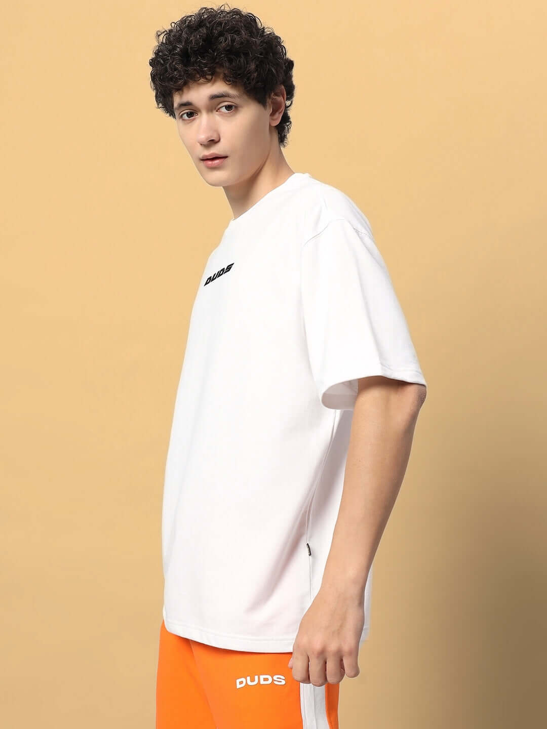 Alt Tag: Model wearing EIGHTFOLD PATH OVER-SIZED T-SHIRT WHITE made from premium heavy gauge fabric with 97% cotton.