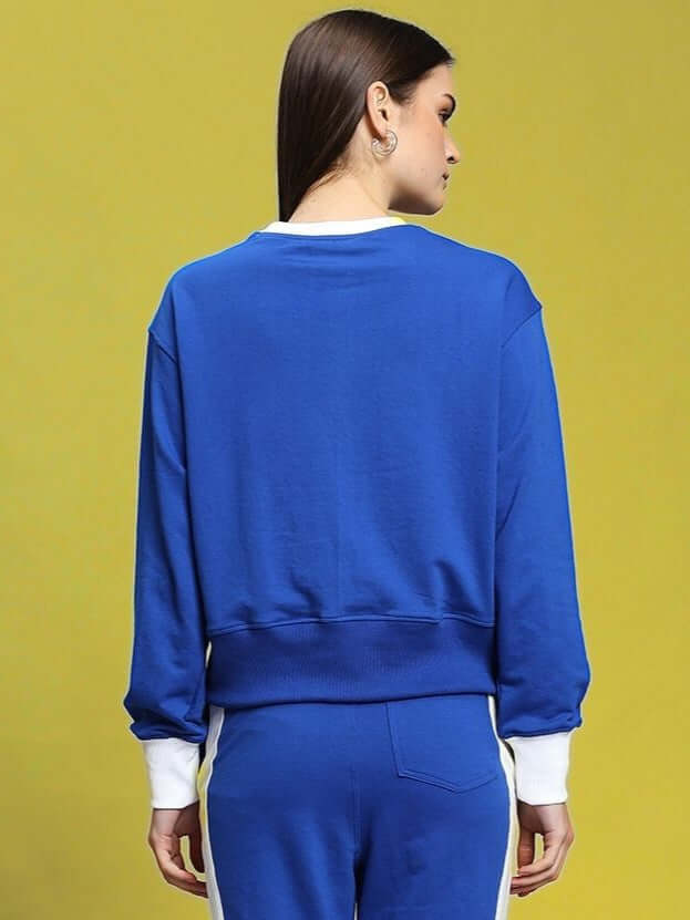Back view of woman wearing a Women's Jessflick Relaxed Fit Sweatshirt in royal blue, made from premium cotton French terry fabric.