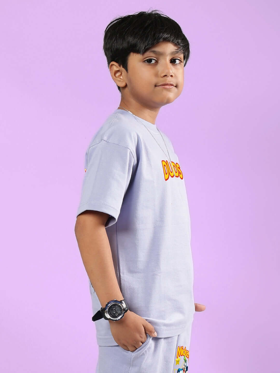 Boy wearing lavender Mickey Dingo T-shirt by DUDS, side view; customizable fit option available, made to order.