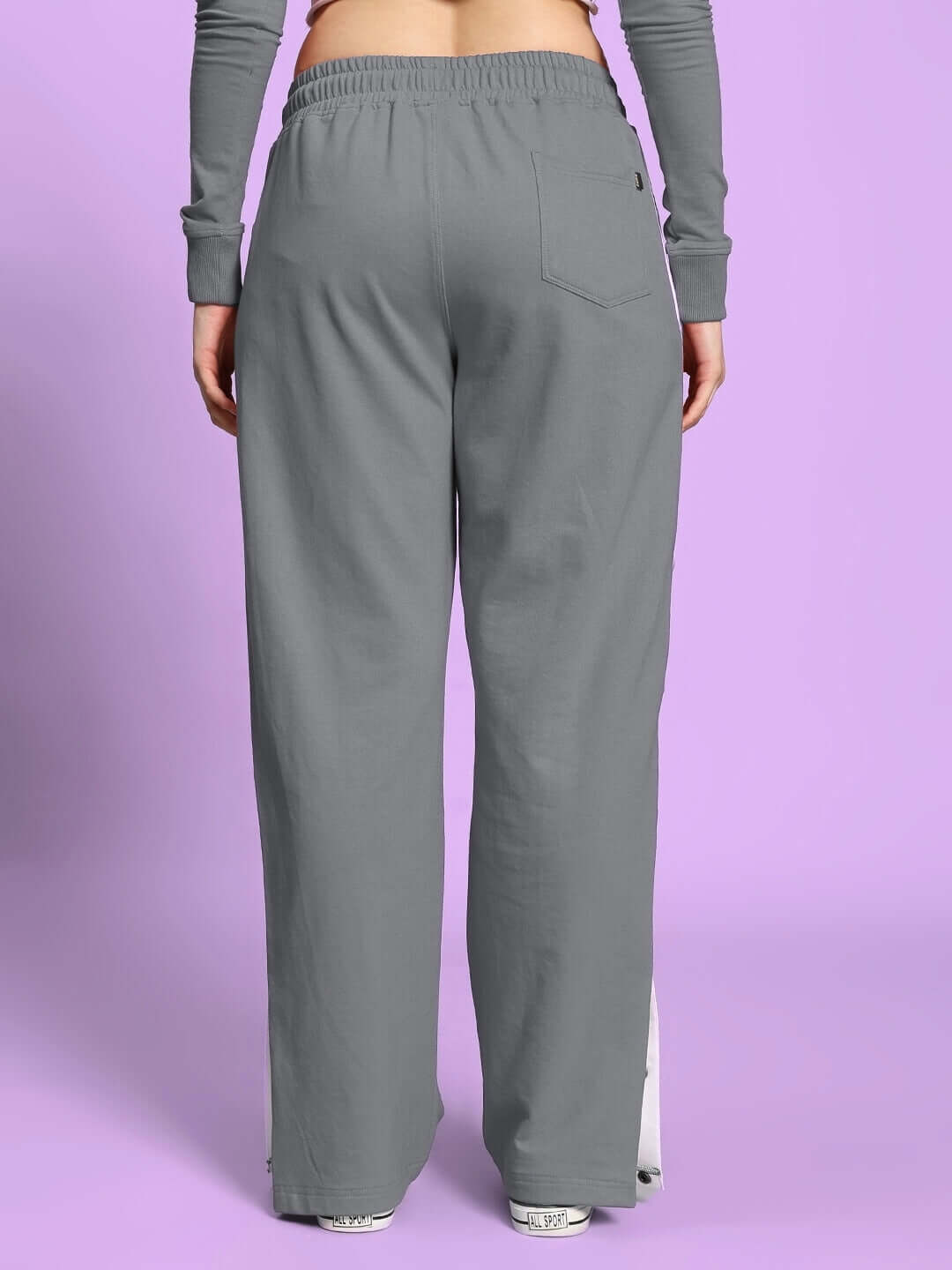 Back view of Women's Ezel Relaxed Fit Jogger in grey, featuring a comfortable elastic waist, ideal for custom fit and everyday wear.