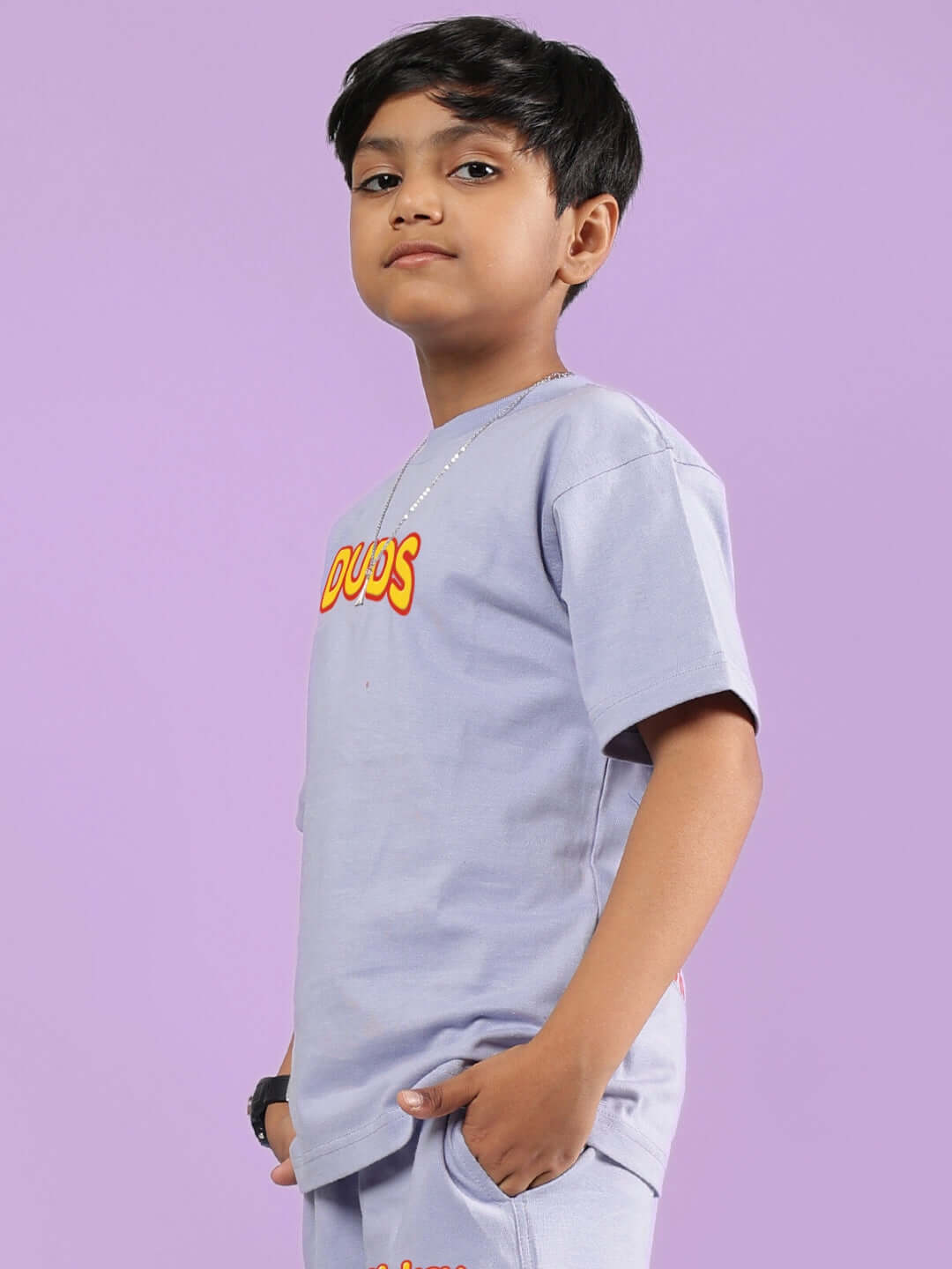 Child wearing lavender Mickey Dingo t-shirt from DUDS, showcasing side view and vibrant design, perfect for boys and girls.