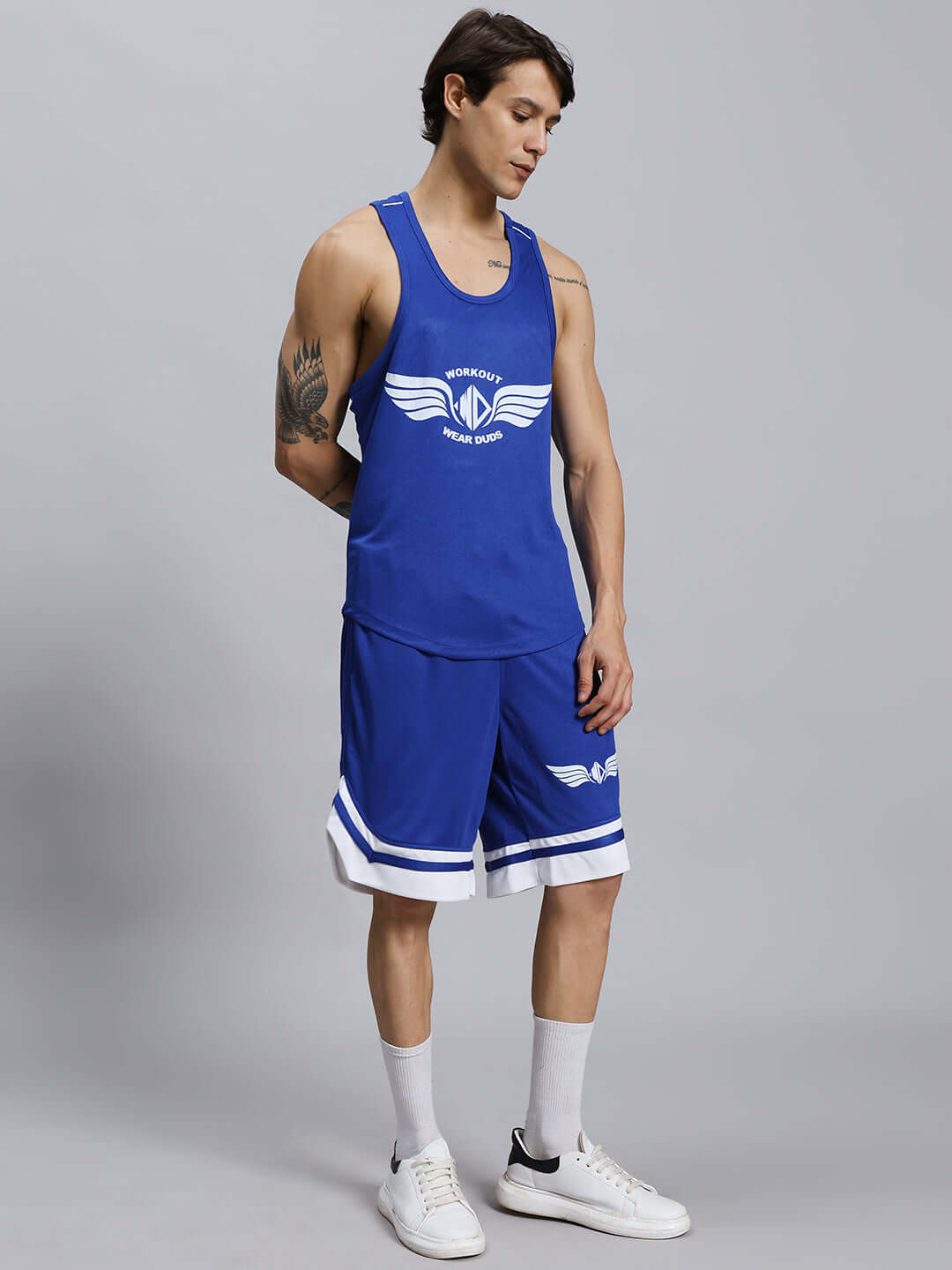Royal blue WD Wings gym co-ord set featuring sports polyester fabric, modeled by a person in a studio setting.