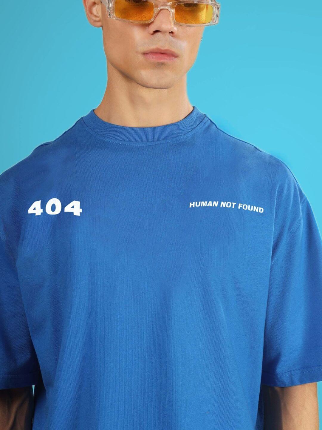 404 ERROR OVER-SIZED T-SHIRT ROYAL BLUE with tech text design worn by model in sunglasses