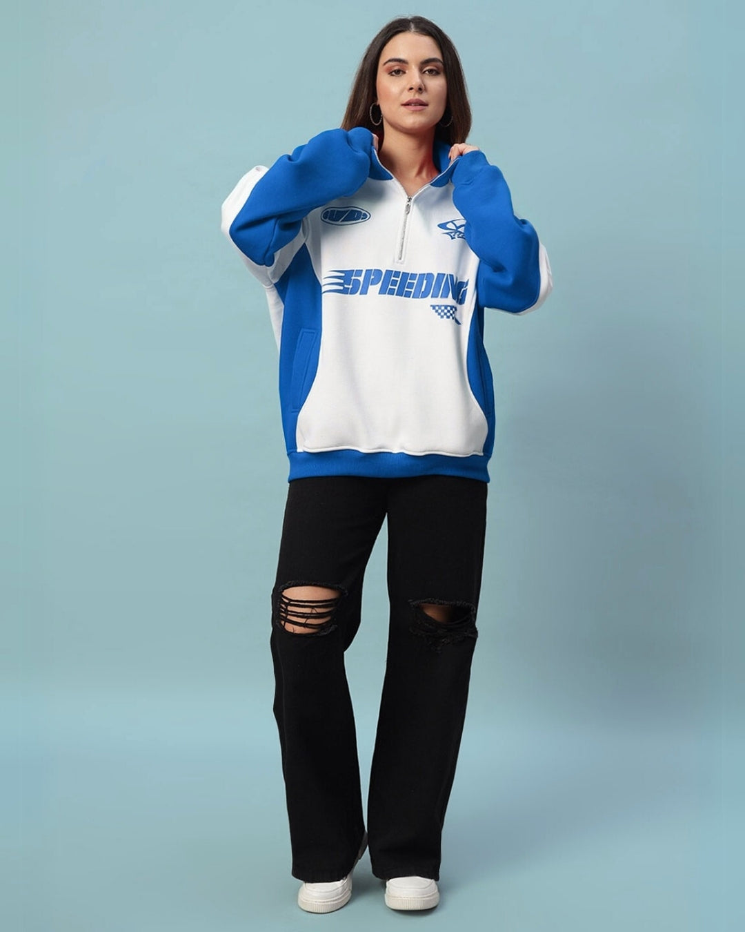 Woman wearing a Women's Speeding Colorblock Jacket in royal blue, featuring a bold sporty look with relaxed fit and full sleeves.