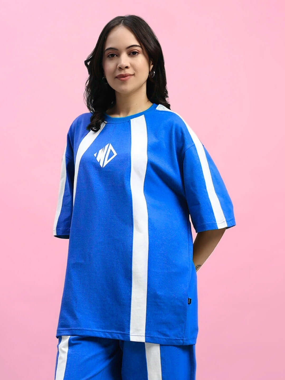 Women's blue over-sized T-shirt with white stripes, made from premium cotton fabric, worn by model. Made in India.
