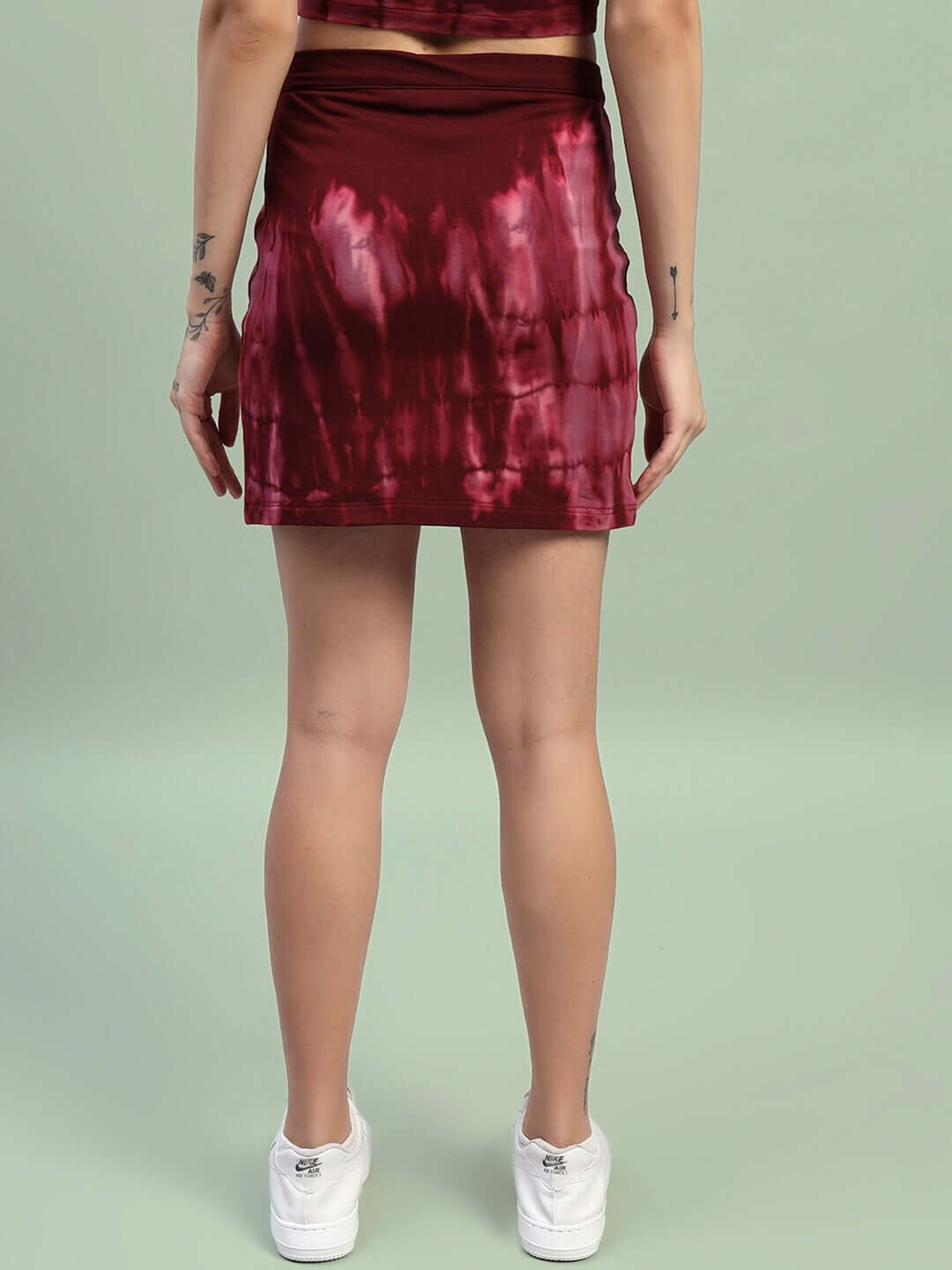 Women's maroon tie-dye co-ord set featuring a skirt, showcasing the back view. Made of premium cotton fabric. Fashion style showcase.