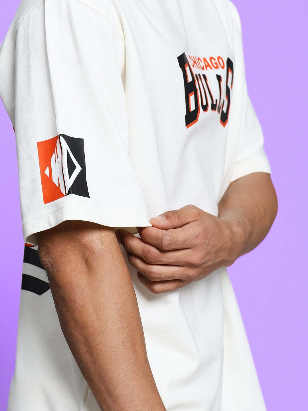 Off-white co-ord set featuring Chicago Bulls print in premium cotton fabric, shown with sleeve detail on a model.