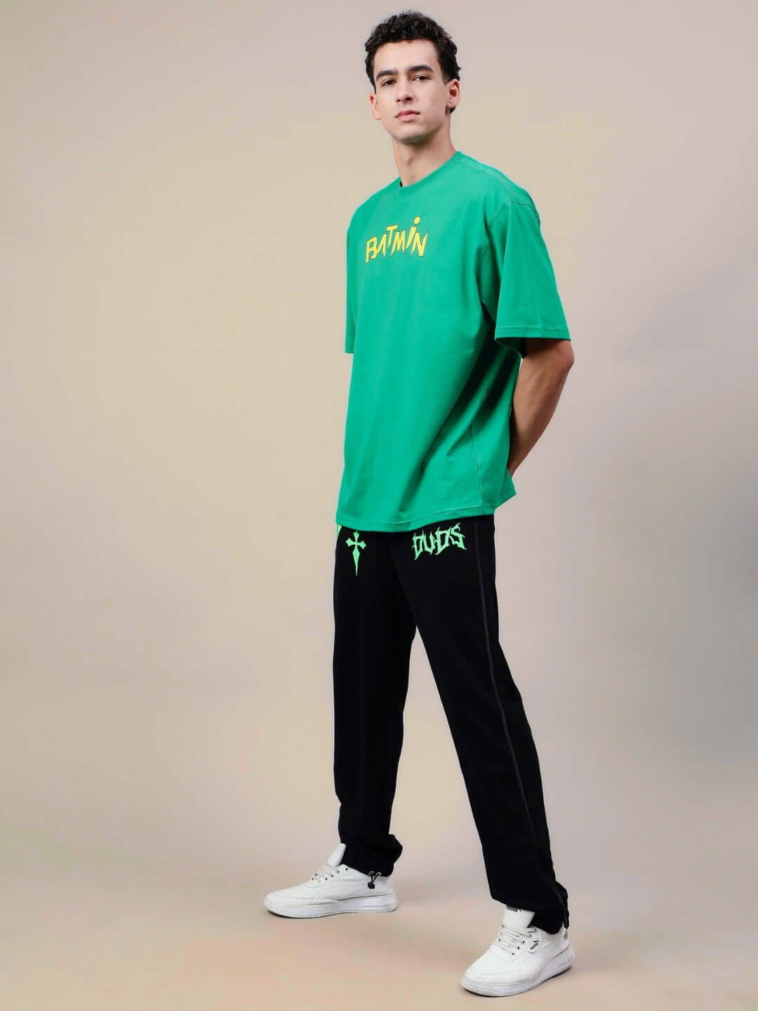 Model wearing BATMIN OVER-SIZED T-SHIRT GREEN, showcasing the casual fit and style, customizable size option available.