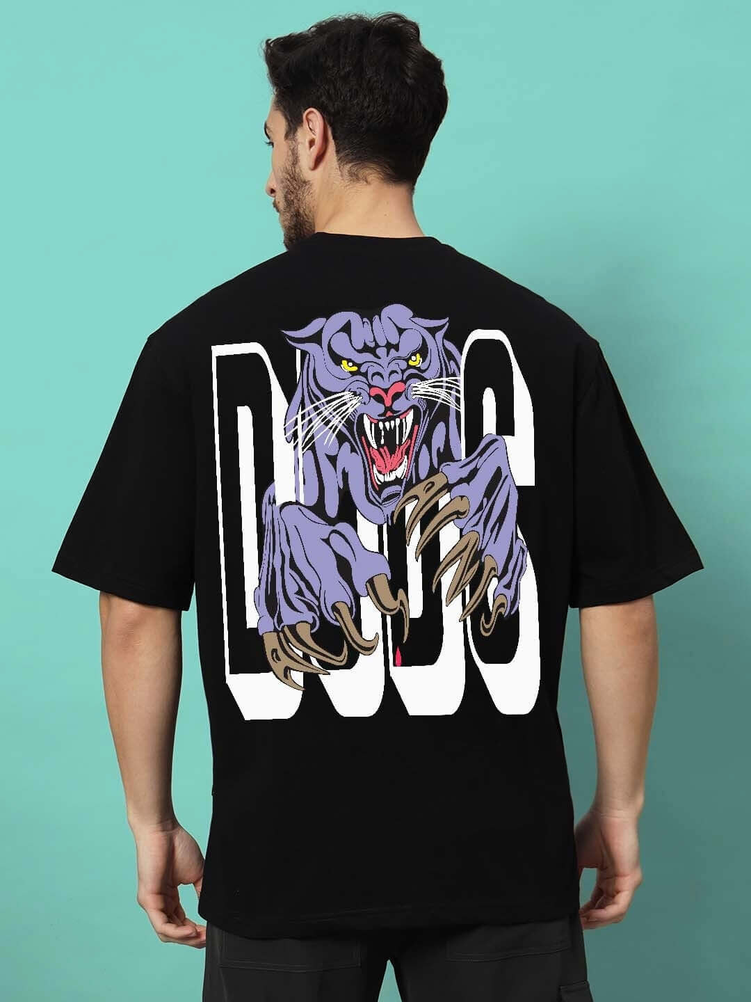 DUDS PANTHER OVER-SIZED T-SHIRT BLACK featuring a bold panther graphic on the back, shown on a model.