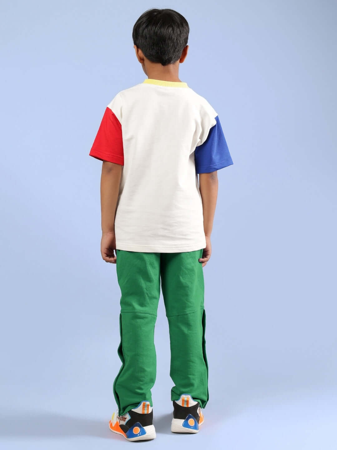 Boy wearing Adonis Co-Ord set with off white, green, and multicolor design, featuring comfortable fit by DUDS.