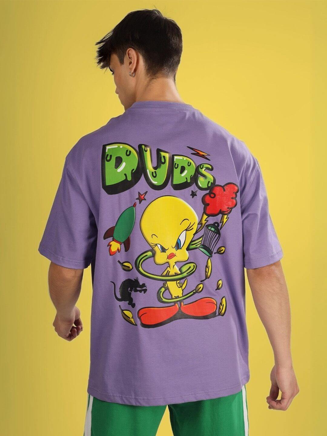 ESCAPED TWEETY OVER-SIZED T-SHIRT WISTERIA PURPLE worn by model, features DUDS cartoon graphic on the back.