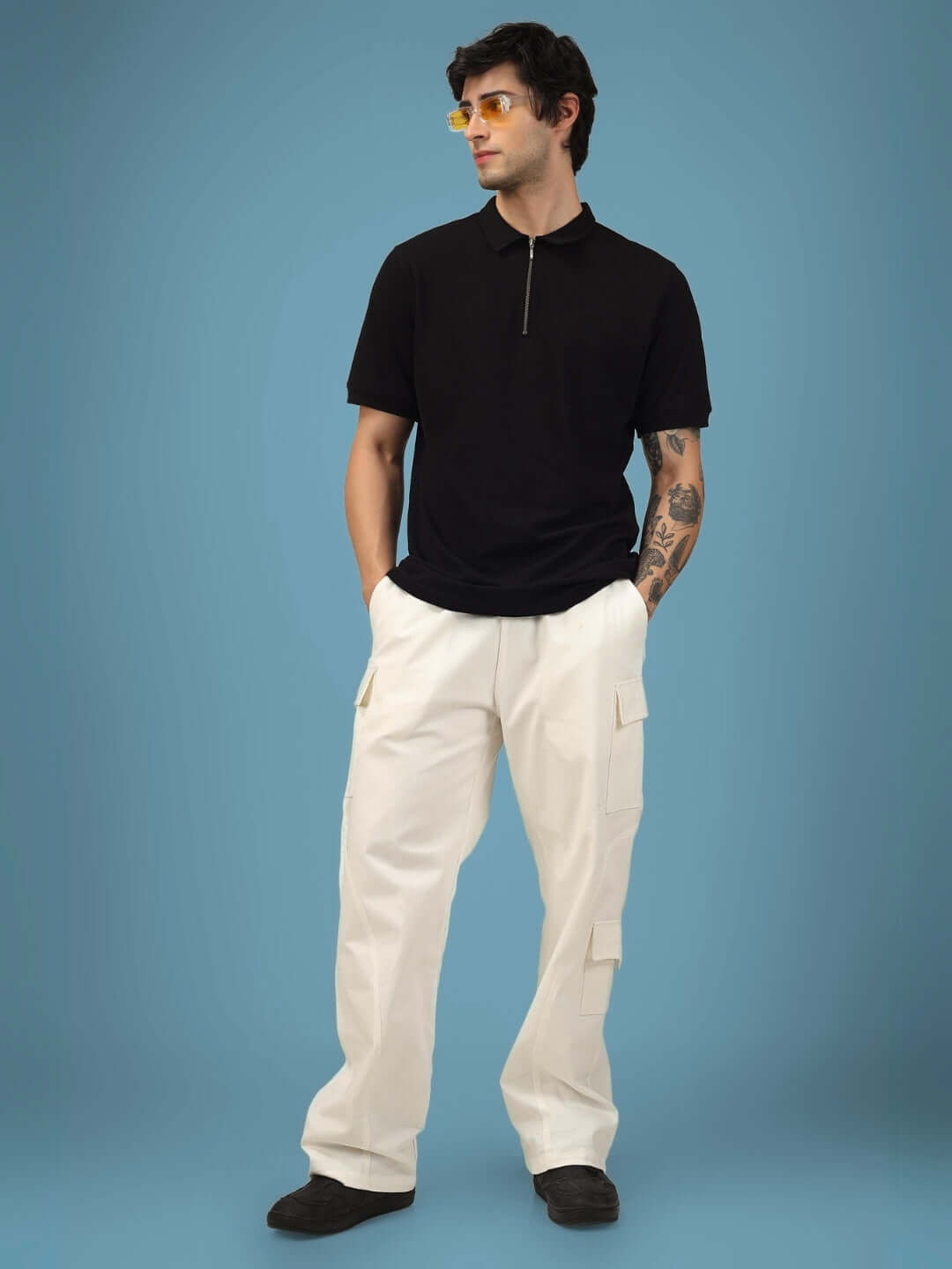 Model wearing white 6 pocket cotton twill cargo pants, showcasing relaxed fit and casual style suitable for customization, by DUDS.