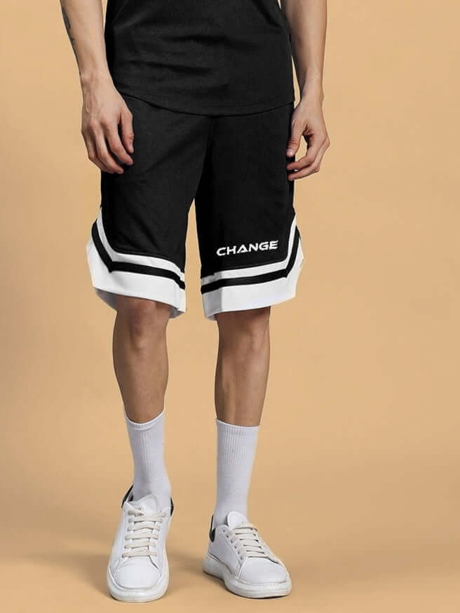 Model wearing FLEX Regular Fit Black Shorts with white accents, showcasing style and comfort. Available for custom fit. Prepaid orders only.