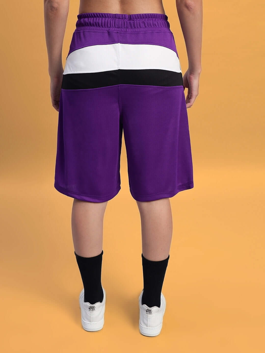 Women's FIFA colorblock co-ord set shorts in purple, black, and white; made of sports polyester fabric, back view.