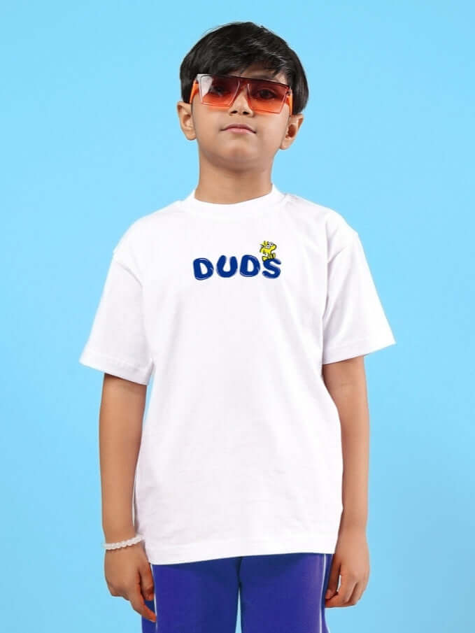 Child wearing Bills Cool Oversized White T-Shirt with Duds logo, ideal for boys and girls, against a blue background.