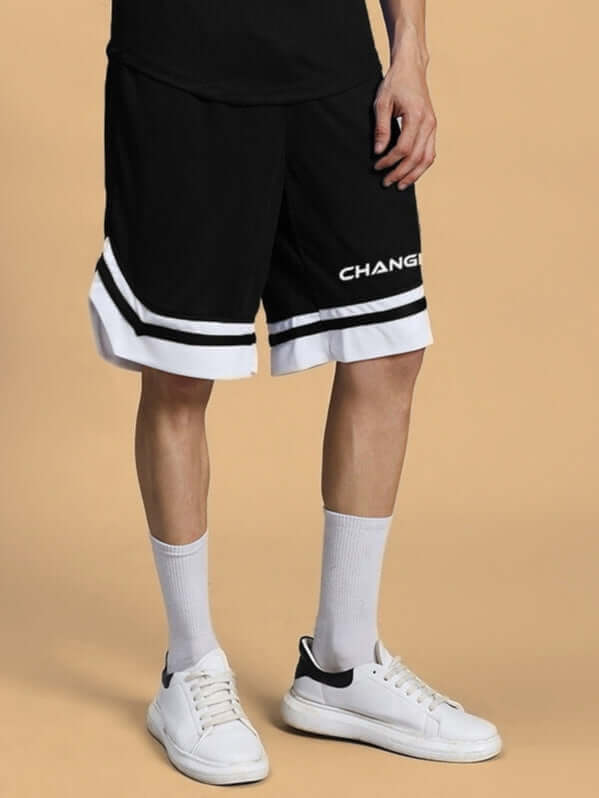 CHANGE YOUR LOOKS regular fit black shorts on model, featuring a customizable fit option for prepaid orders.