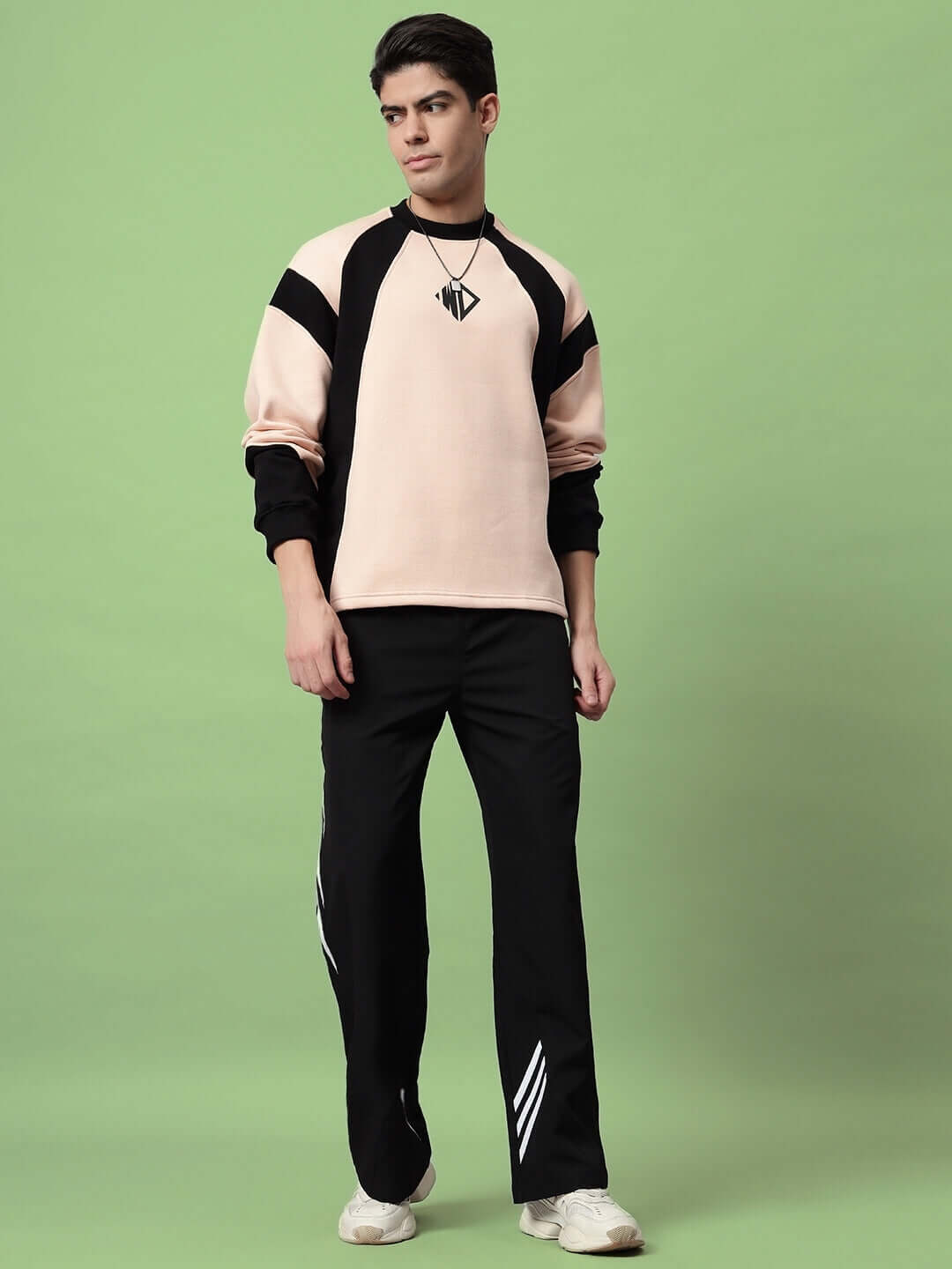 Model wearing ZOOMER RELAXED FIT CARGO PANTS BLACK showcasing street-ready style with spacious cargo pockets.