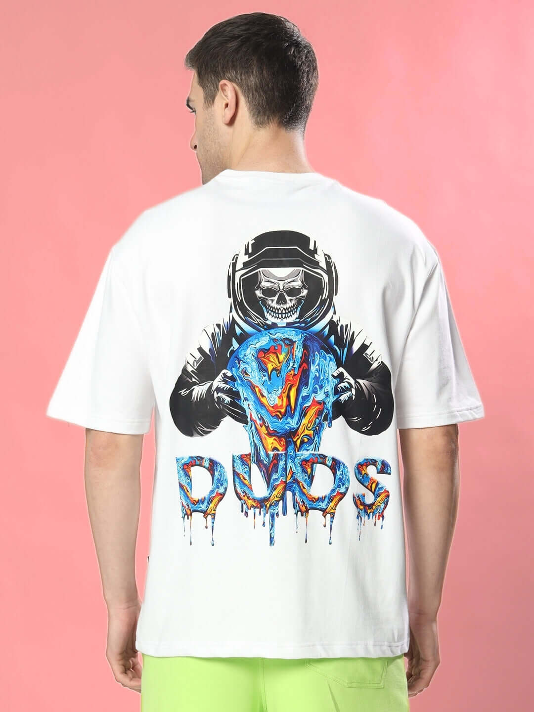 Back view of MELTING EARTH OVER-SIZED T-SHIRT WHITE with bold graphic design, pink background.