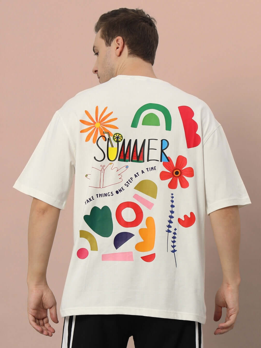 Back view of ONE STEP AT A TIME OVER-SIZED T-SHIRT OFF WHITE featuring colorful summer graphic design, premium 100% cotton material.