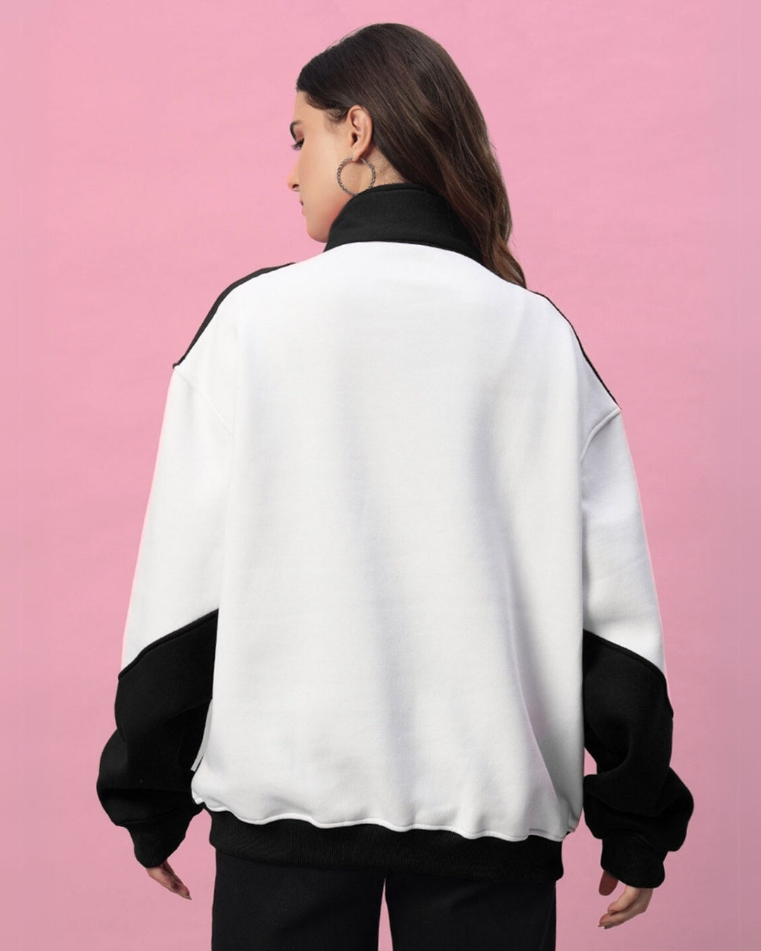 Woman wearing Women's Speeding Colorblock Jacket in black and white, showcasing a relaxed fit and modern streetwear design.