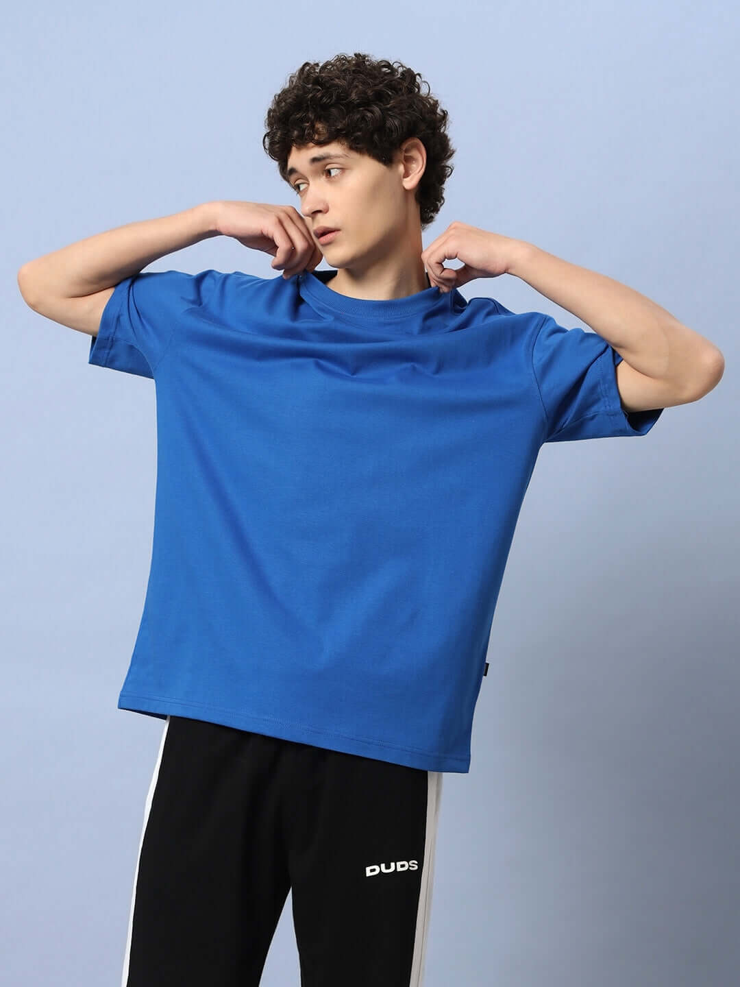 Model wearing LUNA OVER-SIZED T-SHIRT ROYAL BLUE in relaxed fit.