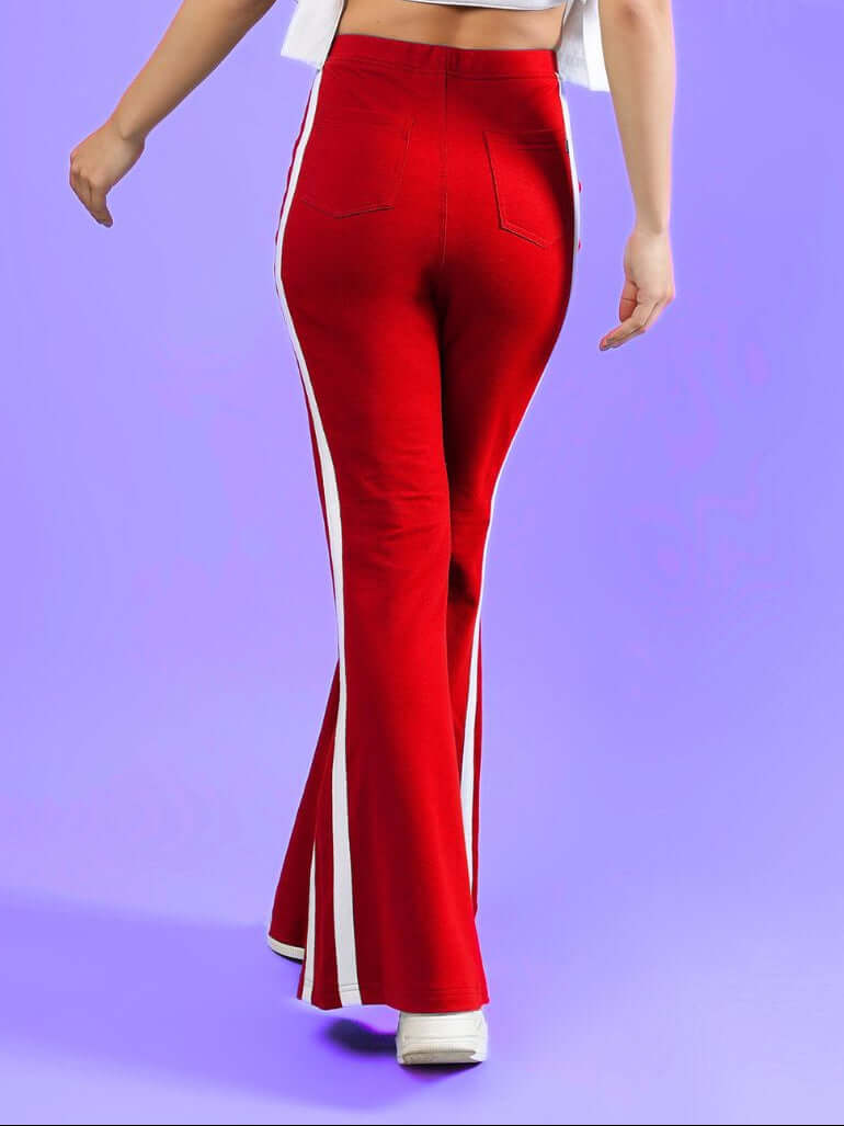 WOMENS FITTONIA COOL WIDE FLARE JOGGERS RED with a stylish wide-flare silhouette in vibrant red color.