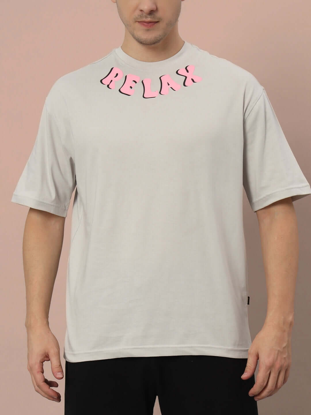 Man wearing FLOATING ROCK OVER-SIZED T-SHIRT GREY with 'RELAX' text, made from 100% cotton, premium heavy gauge fabric.