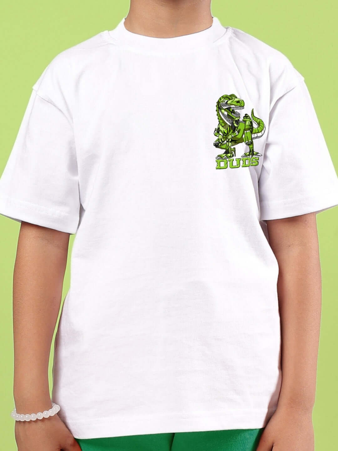 Child wearing Robo Rex oversized white t-shirt with dinosaur print, suitable for boys and girls, from DUDS.