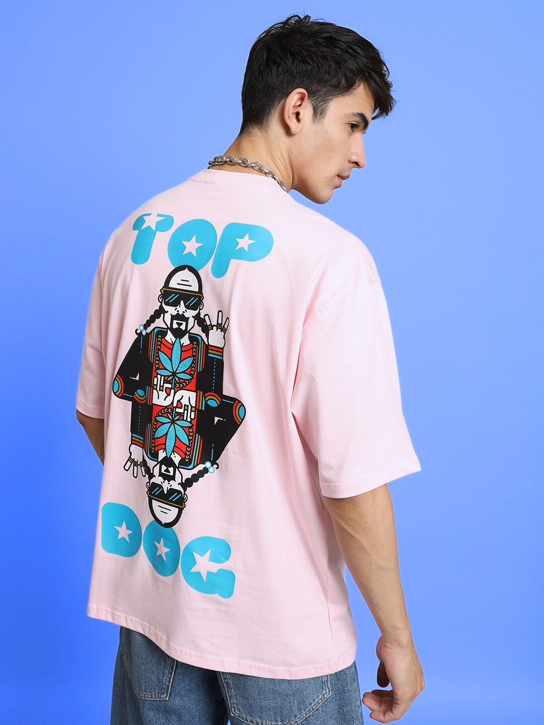 Model wearing TOP-DOG Oversized Pink T-Shirt with graphic design, back view, customizable fit available.