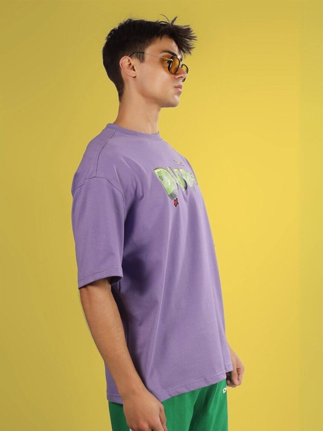 Model wearing ESCAPED TWEETY OVER-SIZED T-SHIRT WISTERIA PURPLE with custom fit option.
