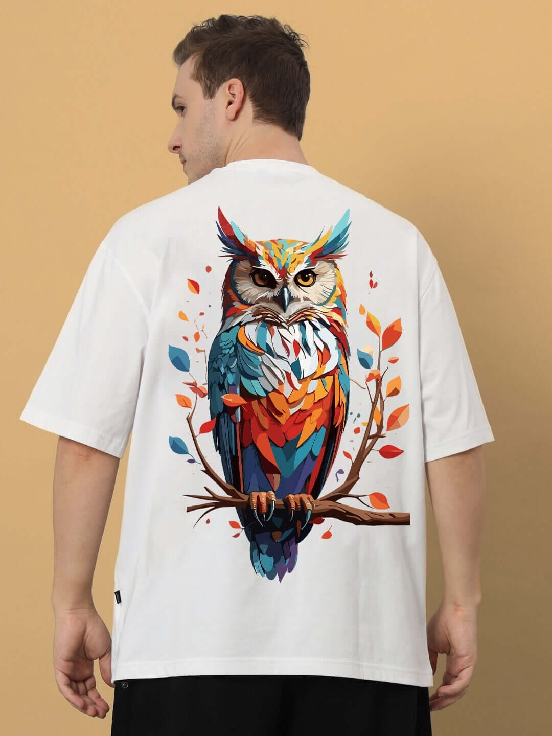 HEDWIG OVER-SIZED T-SHIRT WHITE featuring a vibrant owl design on the back, made from premium heavy gauge 100% cotton, 200 GSM bio-washed.