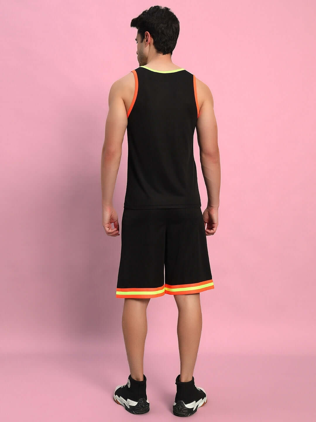 Back view of model wearing Jordan Gym Co-Ord Set in black with red trim, made from sports polyester fabric, ideal for workouts.