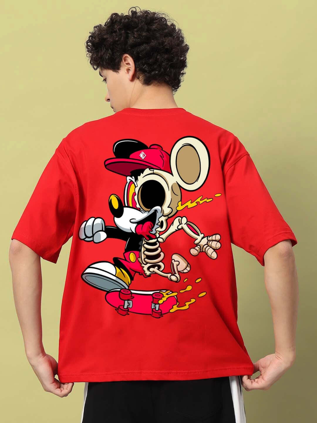 Person wearing MICKEY COTTON OVER-SIZED T-SHIRT RED with cartoon graphic on back