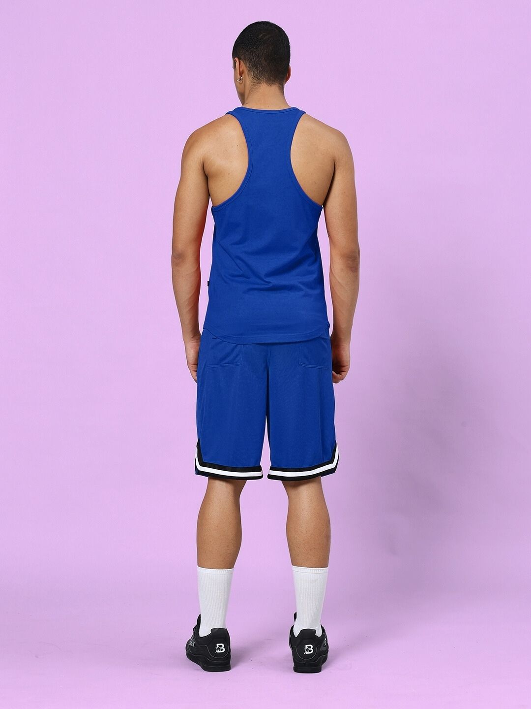 Back view of model wearing TAKE IT EASY GYM CO-ORD SET BLUE
