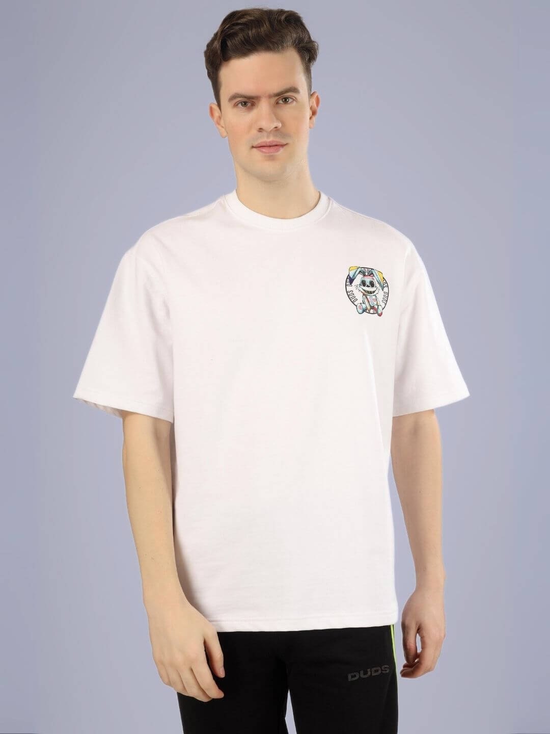 Model wearing A Doll Not Rabbit over-sized printed t-shirt in white with unique design, made from premium 100% cotton.