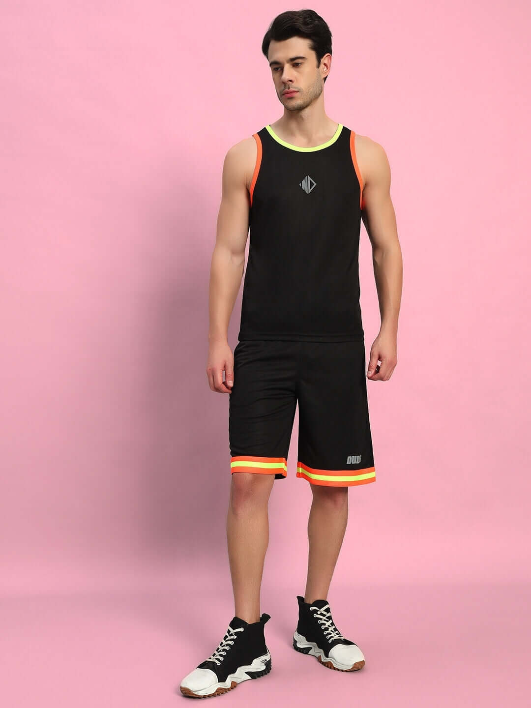 Person wearing black Jordan Gym Co-Ord set made from sports polyester fabric. Includes sleeveless top and shorts. Made in India.
