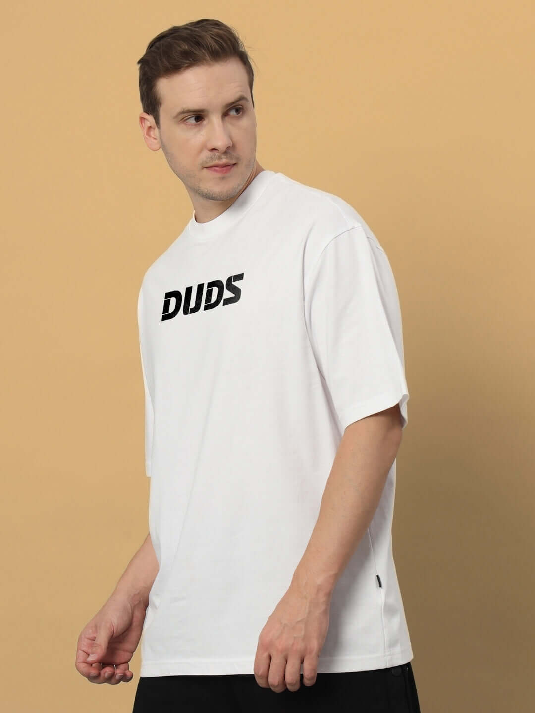 Model wearing LIVING THE LIFE OVER-SIZED T-SHIRT WHITE made from premium 100% cotton fabric.