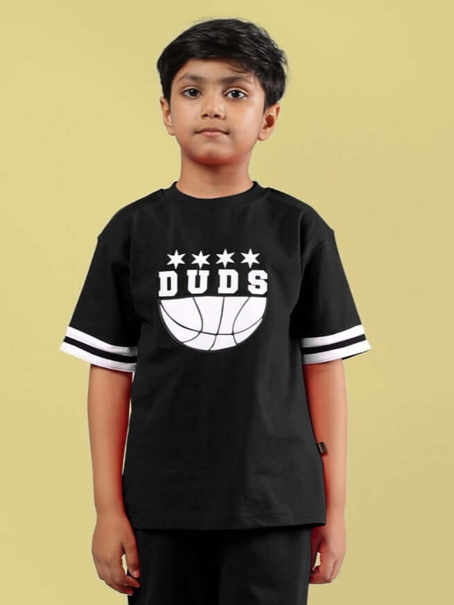 Child wearing black oversized DUDS t-shirt, youth fashion, customizable fit option available, made-to-order apparel.