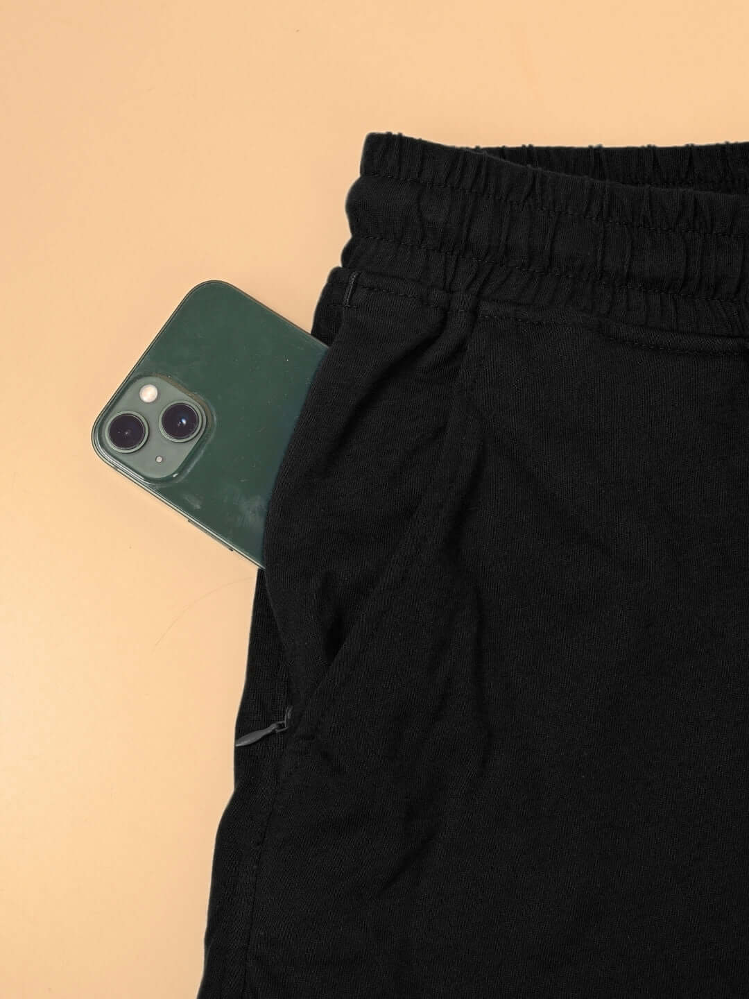 Black Fulness Paradise summer shorts with elastic waistband and phone in pocket, showcasing customizable fit option.