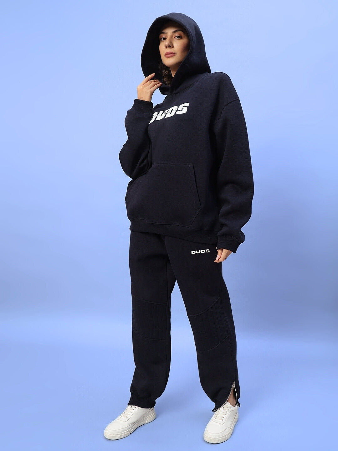 Model wearing women's fight night fleece jogger in navy blue, showcasing cozy and stylish fashion for active wear.