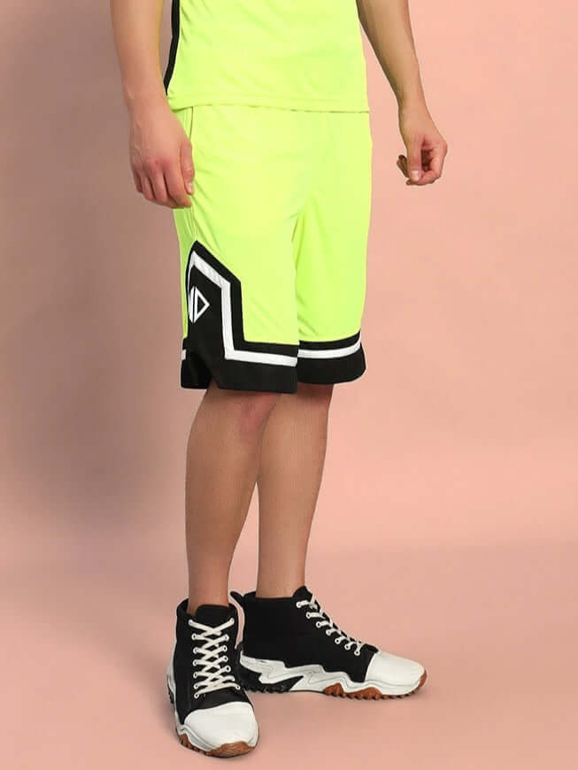 Armado regular fit neon green shorts worn by a model, featuring a customizable size option for a tailored fit; ideal for prepaid orders.
