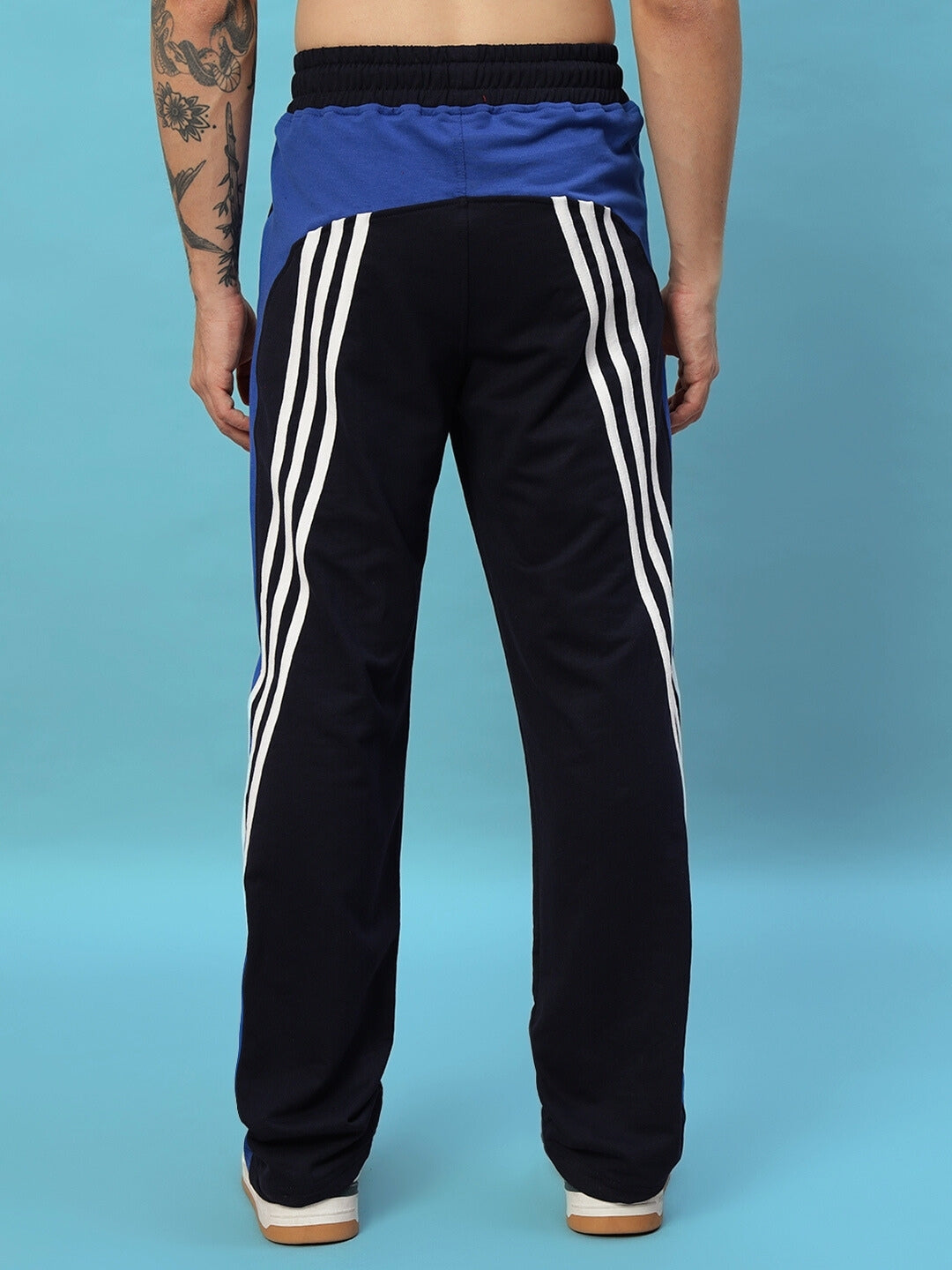 Back view of navy blue Tangle Relaxed-Fit Joggers with white stripes, showcasing custom fit option, made by DUDS tailors.
