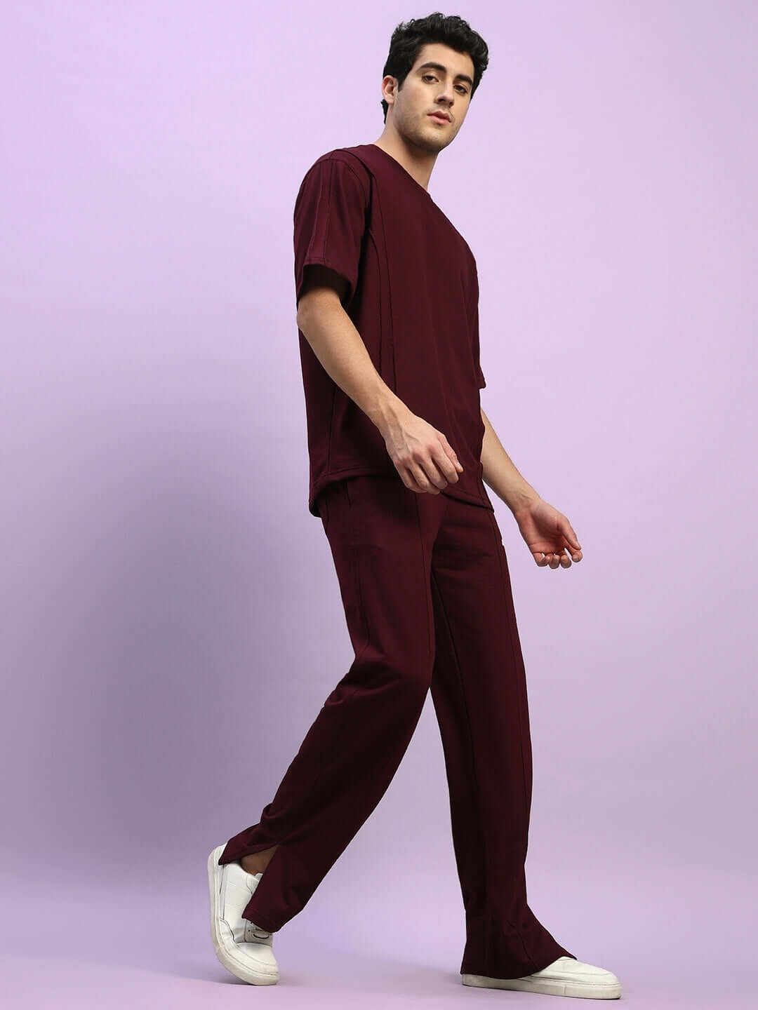 Model wearing ZION relaxed fit maroon co-ord set with joggers and t-shirt, showcasing premium cotton fabric and elasticated waistband.