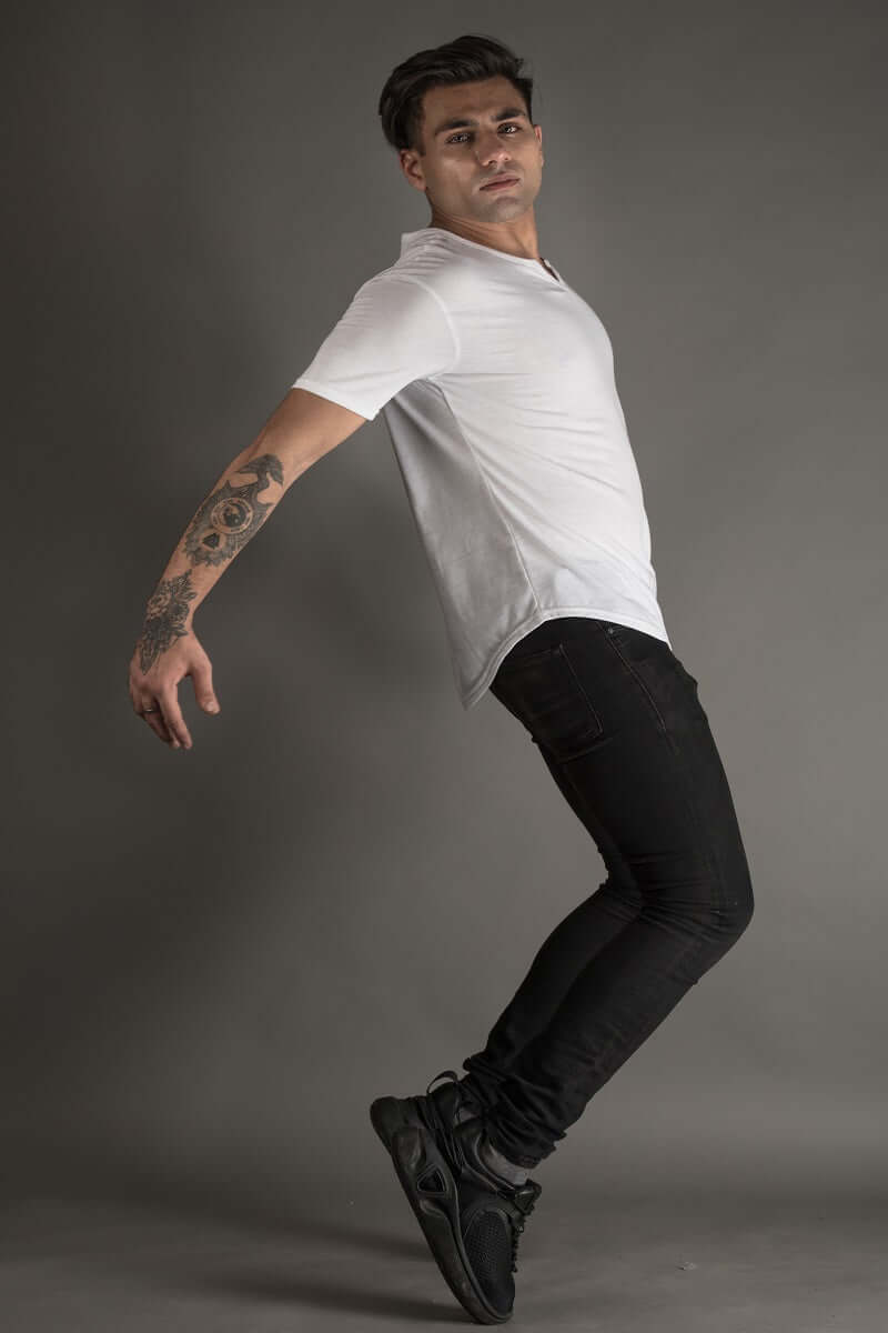 Model wearing VIKING regular fit white T-shirt, 100% cotton, 190 GSM, stylish casual wear for men, full body shot with tattooed arm.