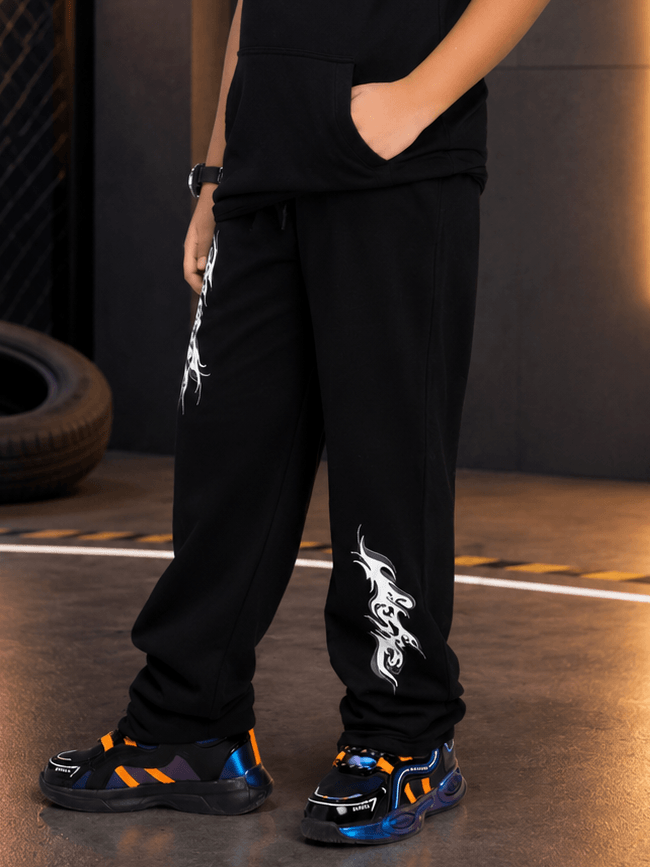 PHANTOM JOGGER FOR BOYS GIRLS BLACK paired with stylish sneakers, perfect for active kids.