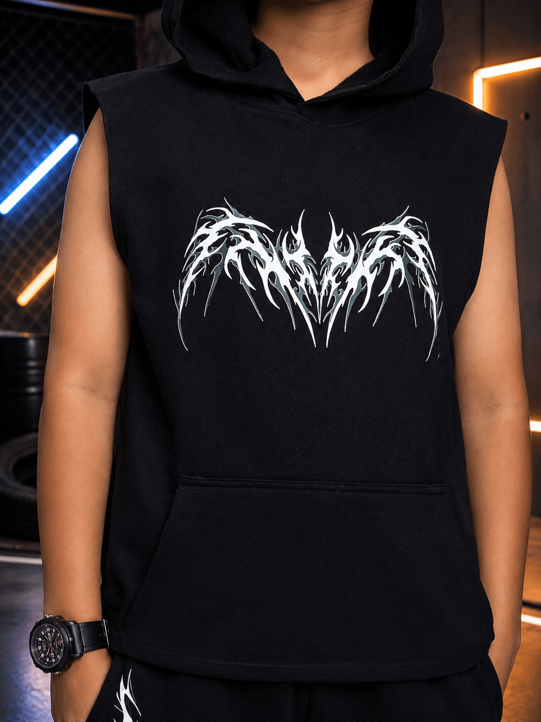 PHANTOM SLEEVELESS HOODED T-SHIRT FOR BOYS GIRLS BLACK featured on a model, showcasing sporty streetwear style.