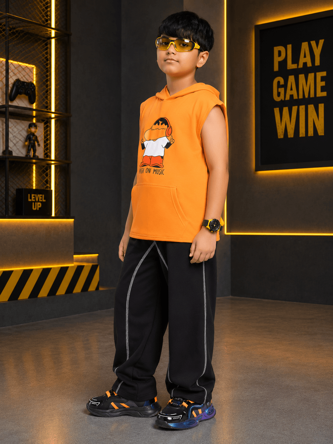 BEAT MODE HOODED CO-ORD FOR BOYS GIRLS ORANGE BLACK model wearing orange hoodie and black pants in modern setting.