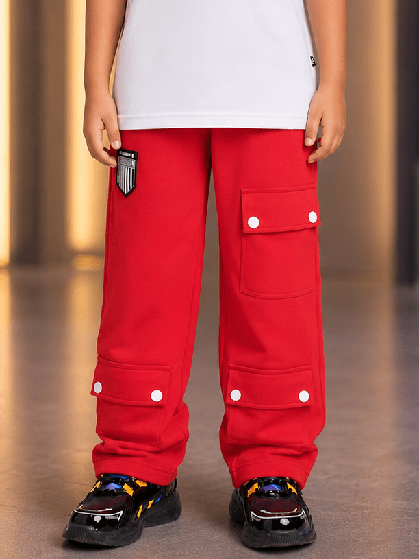 AWESOME FLAP POCKET BAGGY JOGGER FOR BOYS GIRLS RED displayed on a child, featuring flap pockets and a relaxed fit.