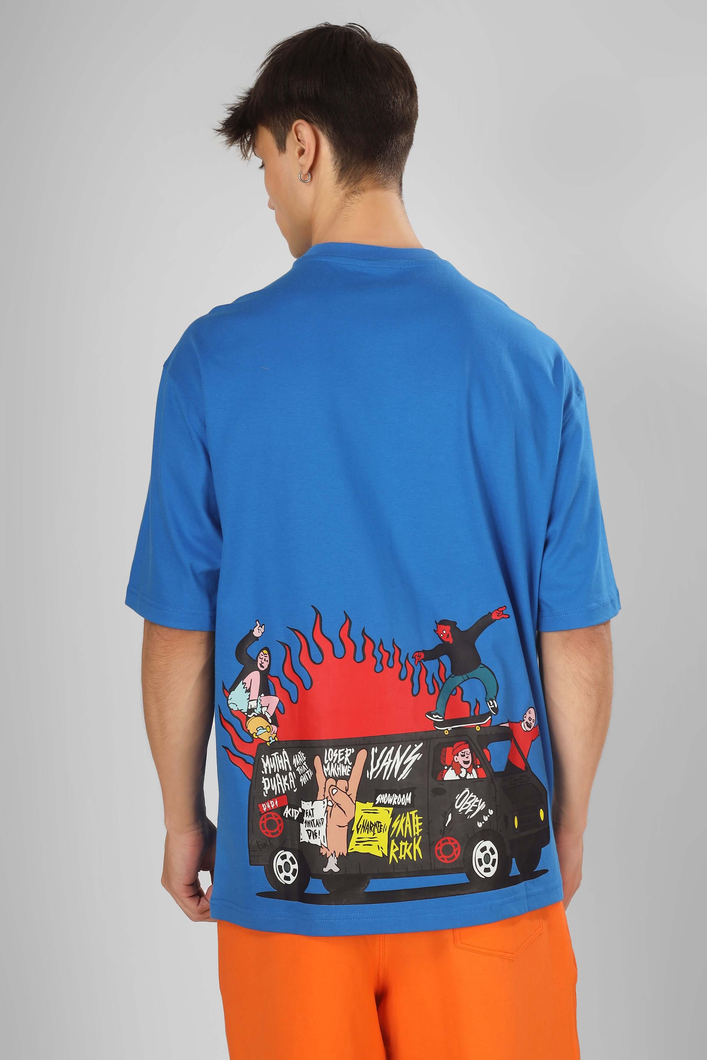 Model wearing DUDS VAN OVER-SIZED T-SHIRT ROYAL BLUE with graphic print on the back, available for custom fit.